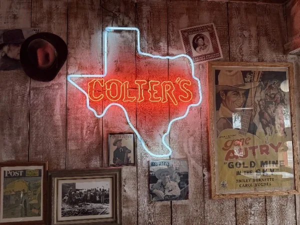 Colter's Texas neon sign on the restaurant wall